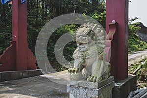 Stone lion statues at entrance of Mingyue Buddhist Temple