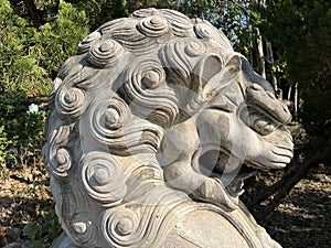 Stone lions on a bridge in a garden