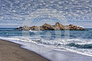 Stone loberia.Playa Cobquecura, Chile photo
