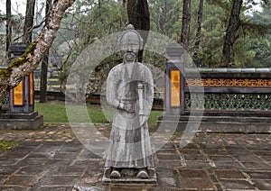 Stone mandarin sculpture in the forecort preceding the Stele Pavilion in Tu Duc Royal Tomb, Hue, Vietnam