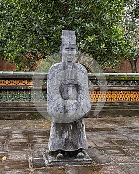 Stone mandarin sculpture in the forecort preceding the Stele Pavilion in Tu Duc Royal Tomb, Hue, Vietnam