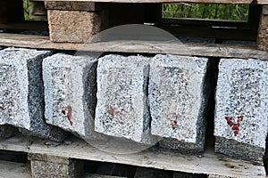 Stone marble building blocks are stored outside