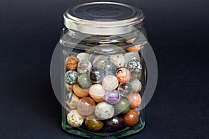 Stone marbles in a jar