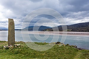 Stone marker on shore of Kyle of Durness, Scotland.