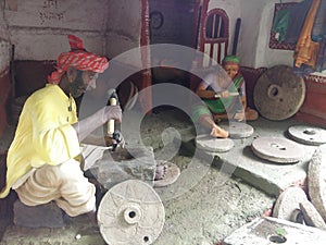 Stone Mason Making Grinder