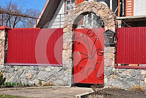 Stone and Metal Red Fence with Door