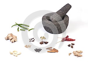 Stone mortar and pestle with herbs
