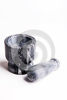 Stone mortar with pestle on white background