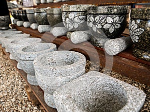 Stone Mortar and Pestles Arranging in Rows