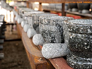 Stone Mortar and Pestles Arranging in Rows