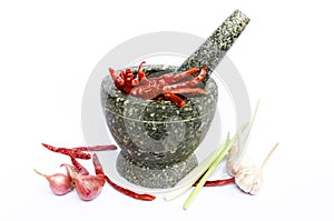 Stone mortar with red chillies