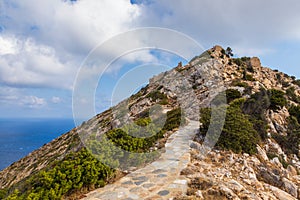 Stone mountain path to Palaiokastro, Ios Island, Greece photo
