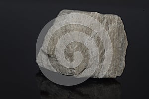 Stone orthoclase mineral white color on black background