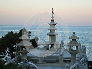 Stone Pagoda and Stone Lanterns Against Evening Sea and Sky, Haedong Yonggung Temple in Busan