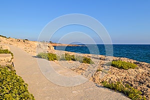 Stone path along the coast of the sea. Ayia Napa Cyprus.