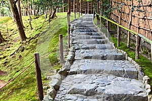Stone pathway and stair are for walking in beautiful moss garden of Ginkakuji shrine. The Ginkaku-ji or Jisho-ji is a Zen temple