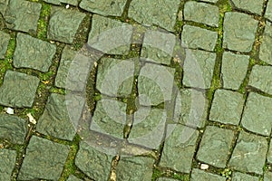 Stone pattern from old square blocks close up