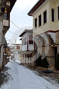 Stone paved alley in winter