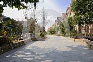 Stone paved street in exotic town at sunny winter noon