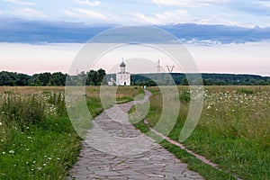 The stone-paved trail through the Bogolubovo meadow towards Church of the Intercession of the Holy Virgin on the Nerl River.