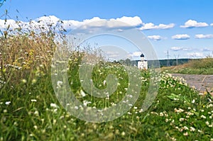 The stone-paved trail through the Bogolubovo meadow towards Church of the Intercession of the Holy Virgin on the Nerl River.