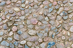 Stone pavement made of colored stones in an old fortress.