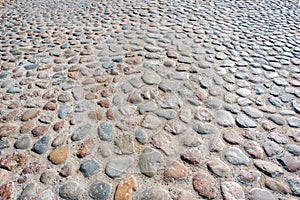 Stone pavement texture. Cobblestone pavement. Cobbles texture - hard pavement, a kind of pavement.