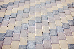 Stone pavement texture. Granite cobblestoned pavement background. Abstract background of old cobblestone pavement close-up.