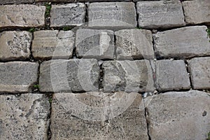 Stone pavement texture. Granite cobblestoned pavement