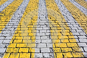 Stone pavement texture with pedestrian crossin