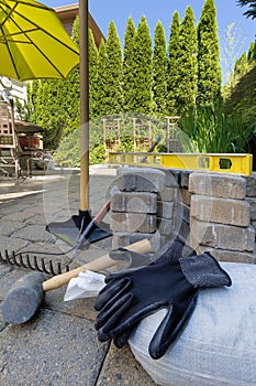Stone Pavers and Tools for Backyard Hardscape photo