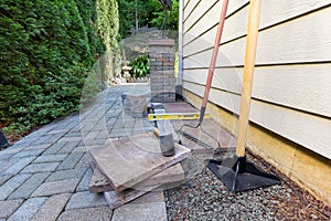 Stone Pavers and Tools for Side Yard House Landscaping photo
