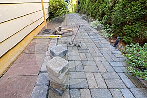 Stone Pavers and Tools for Side Yard Landscaping photo