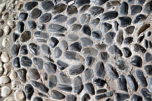 Stone paving background - granite cobblestone pattern on the floor.