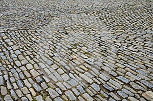 Stone paving medieval, granite, gneiss, small rectangular shape brushed old stones cobblestone paving, path, sidewalk gray brown c