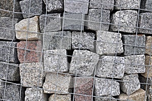 Stone paving stones of granite in a containe