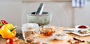 Stone pestle and mortar with oil and spices
