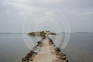 Stone pier leading to a house on the secluded islet