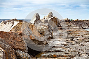 Stone pier with people walking on it