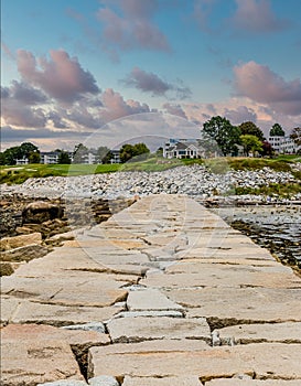 Stone Pier Toward House in Maine