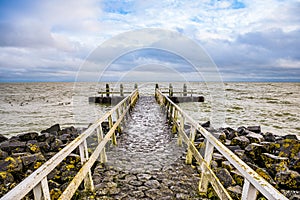 Stone pier by the Vlietermonument near Den Oever in Netherlands