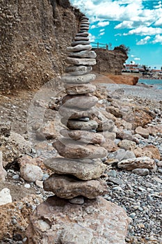 A stone pile on the sea beach. Stone tower closeup.