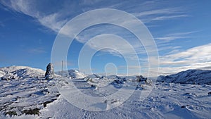 Stone pile in snow on Mount Hoven in Loen in Vestland in Norway