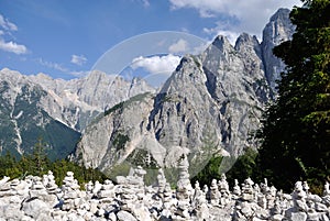 Stone piles in Kranjska Gora  Vrsic in front of mountain range photo