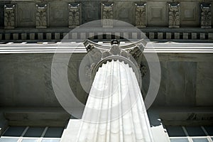 Stone pillar bottom view. Column on marble background. Architecture, structure and design. Support and decoration