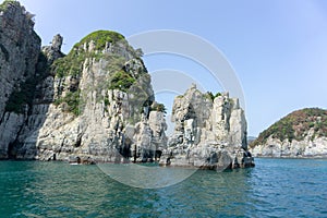 Stone pillar emerged from the sea is the part of Geoje Haegeumgang rock islands