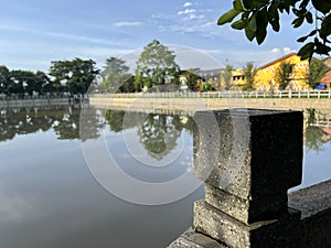 Stone pillar on the lake with blurred background