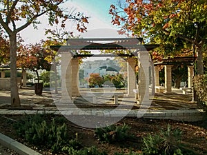 Stone pillared gazebo, with green metal roof in park