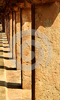 Stone pillars shadow of surrounded way hall in the ancient Brihadisvara Temple in Thanjavur, india.