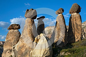 Stone pillars with top hats.